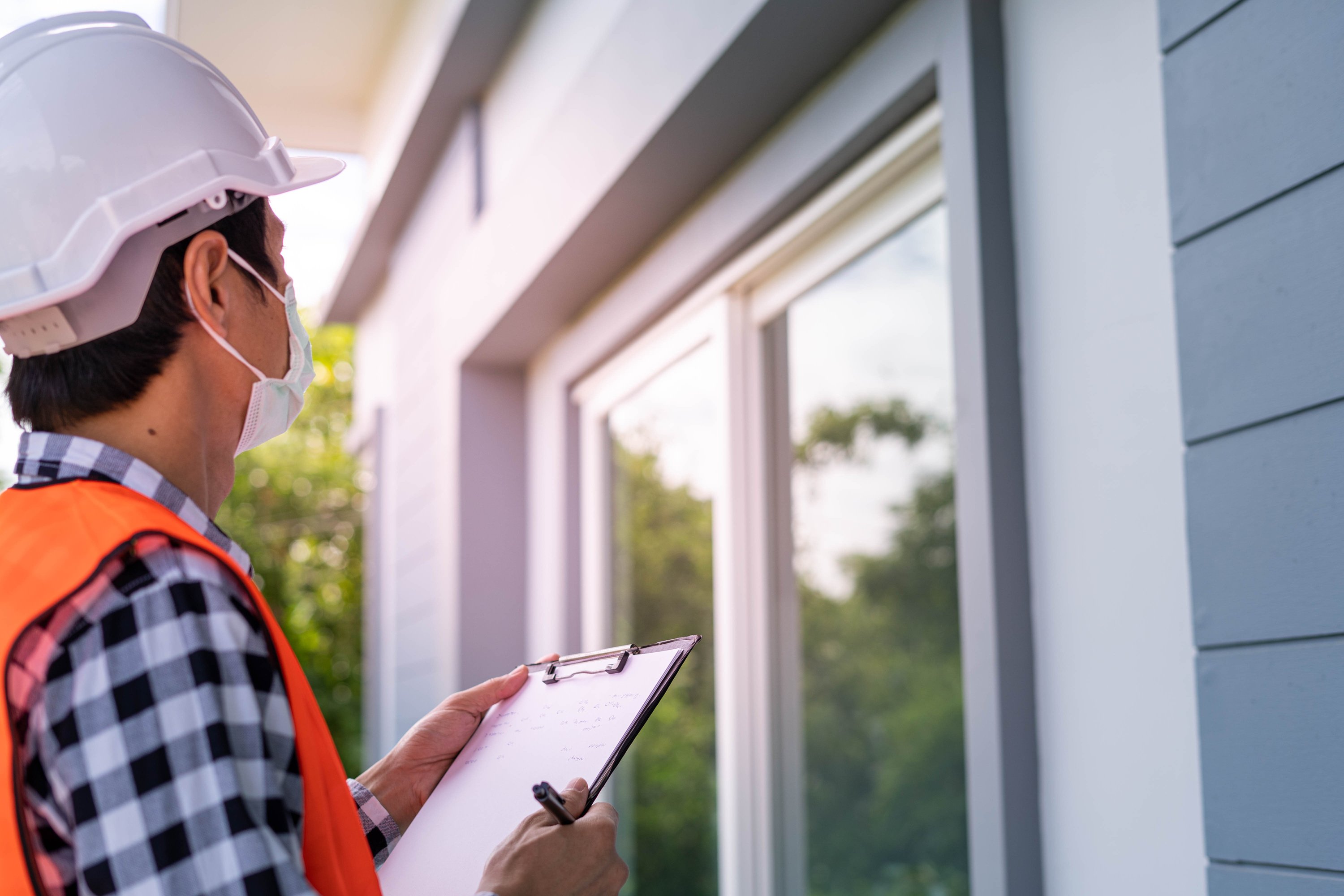 Engineer Inspecting the House Building